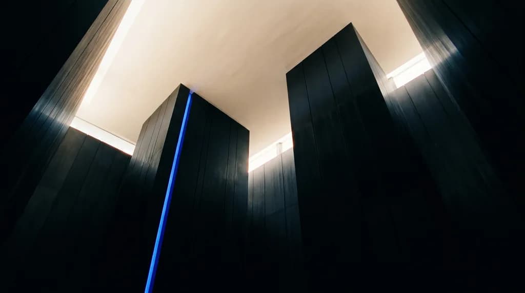 Tall minimalist atrium with vertical ink planes and morning light