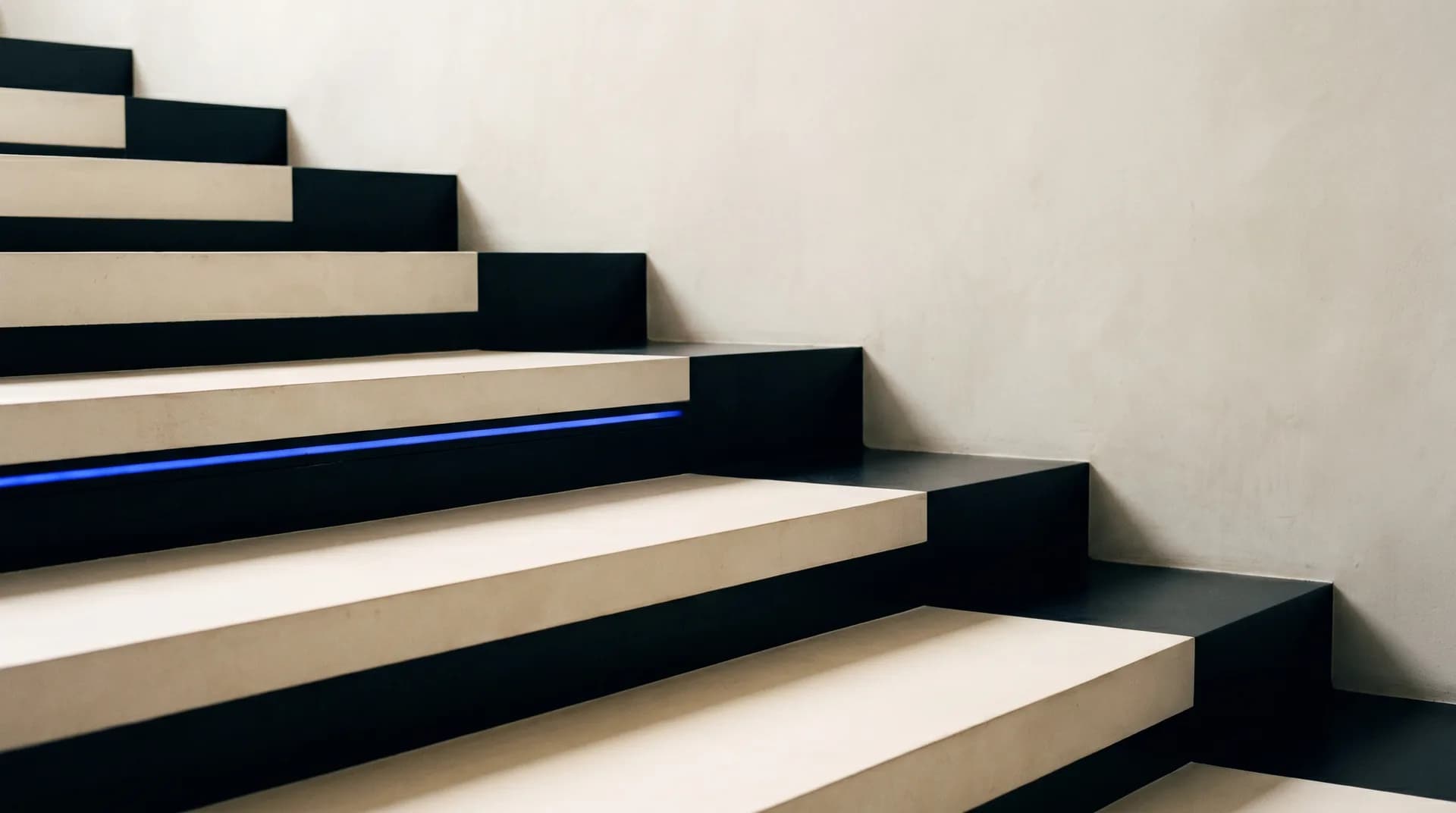 Curving pathway leading through a minimalist interior space